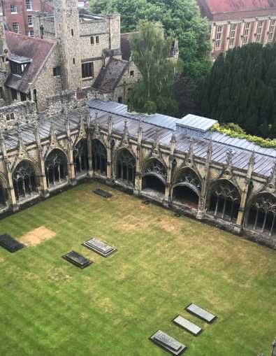 The cloister, looking from the edge, through the columns, across the grass covered centre.